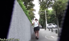 Asian ho pissing outdoors