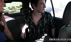 Brunette college beauty giving blowjob to coed in the car